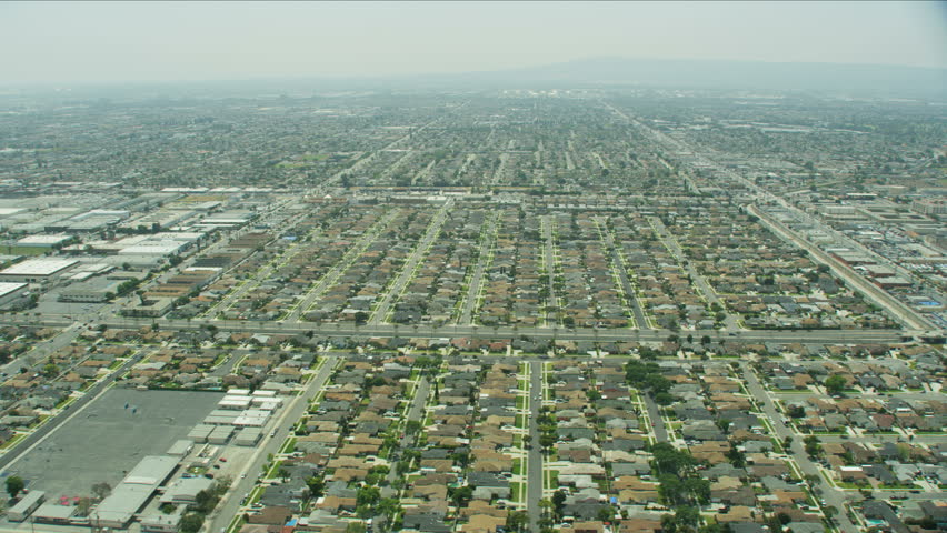 Aerial view of suburban Los Angeles commercial and residential properties located within the LA Basin a sedimentary area known as Peninsular Ranges California USA