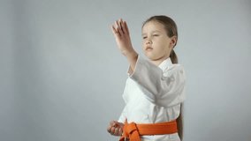 Blows hands girl is beating in karategi