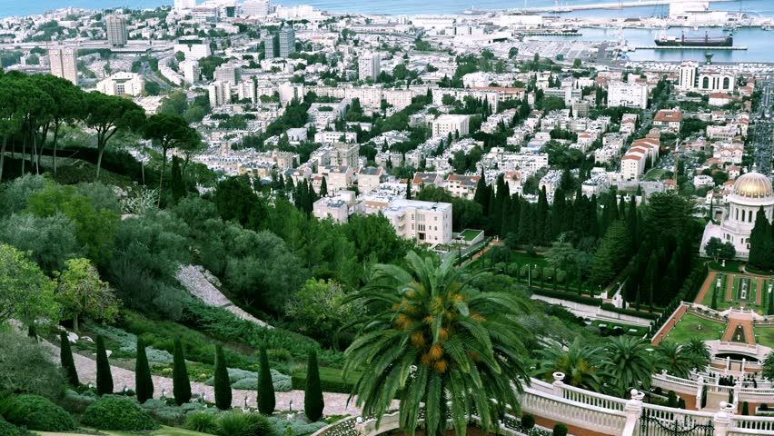 Golden dome of Bahai temple. Haifa city harbor and bay panorama from the top of Mount Carmel at overcast winter day. Israel