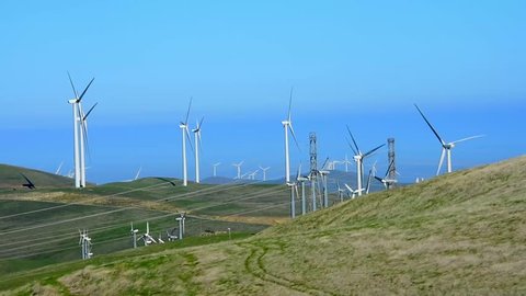 Lazy windmills in the coastal hills in central California. Camera locked.