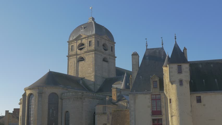 Gothic style basilique Notre Dame of Alencon lower Normandy France in front of blue sky 4K 2160p UltraHD footage - Christian religion building in town of Alencon Orne region 4K 3840X2160 UHD video