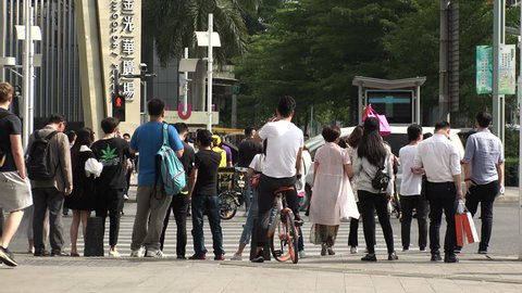 SHENZHEN, CHINA - CIRCA APRIL 2018 : FACIAL RECOGNITION TECHNOLOGY to identify jaywalkers and automatically issue them fines by text.  Offenders faces are displayed on screens at crossings.