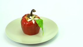 Sweet pepper stuffed with rice and minced meat. The video shows a dish, rotating slowly