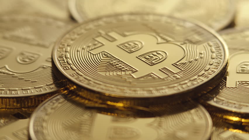 Crypto currency, bitcoin. BTC, Bit Coin. Blockchain technology, bitcoin mining. Macro shot of rotating bitcoins Royalty-Free Stock Footage #1009946426