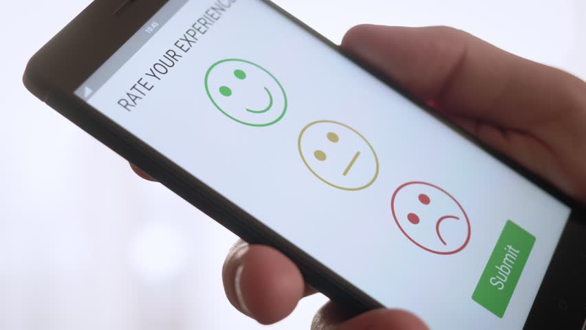 Giving a positive feedback on customer satisfaction app using smartphone | Shutterstock HD Video #1009947131