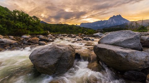 Beautiful Shallow Rapid River With Mount Kinabalu In Background with reflection, Time Lapse, 4KUHD, Night to Day