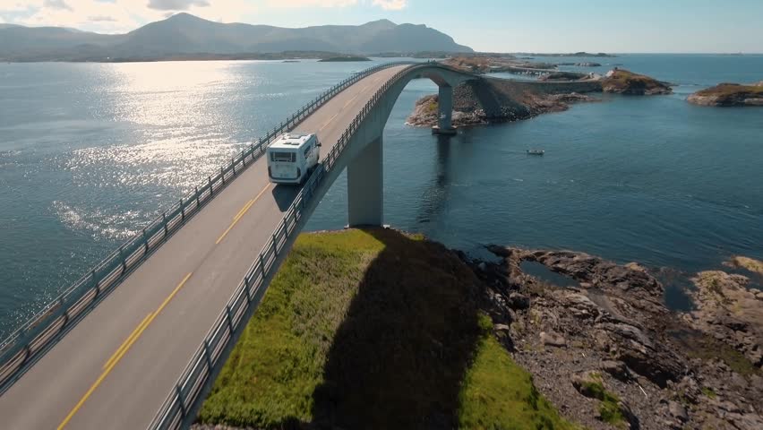 Aerial view of camping cars on Atlantic Road (Atlanterhavsveien) also known as ”The Road in the Ocean” in Norway. National Tourist Route.  Royalty-Free Stock Footage #1009954094