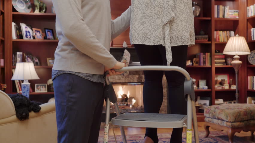Medium shot of a couple hugging under a mistletoe
