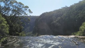 Wentworth falls in Katoomba, UHD tilt view on the top of the waterfall, in blue mountains national park , on a sunny summer day, in Sydney, Australia
