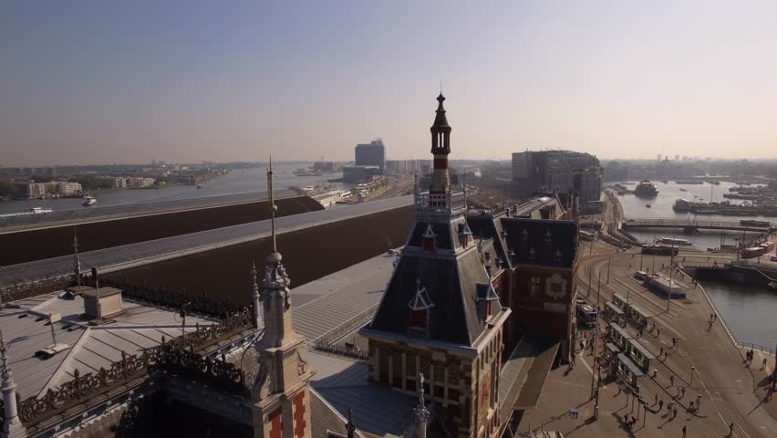 Amsterdam Aerial Sightseeing. Flying Near Central Train Station. 4K