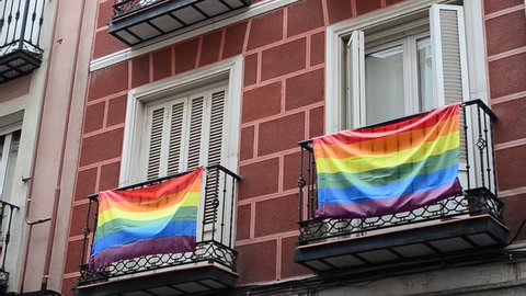 Rainbow flag (LGBT movement) on balconies in Madrid, Spain. Video stock