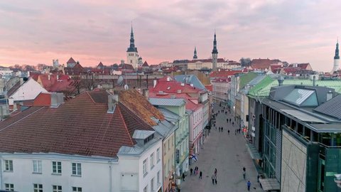 Aerial of medieval Tallinn old town during colorful sunset (trademarks blurred)