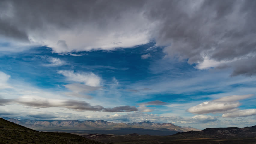 Time Lapse Clouds Over desert Mountains 