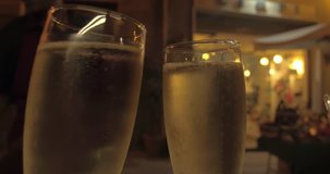 CAGLIARI, SARDINIA, ITALY – JULY 2016 : Video shot of clinking champagne glasses in a local restaurant at night