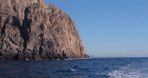 SARDINIA, ITALY – JULY 2016 : Video shot of cliffs on Porto Flava beach on a sunny day with sea and blue sky in view