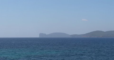 ALGHERO, SARDINIA, ITALY – JULY 2016 : Video shot of the view from city walls on a sunny day with sea and mountains in view