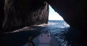 SARDINIA, ITALY – JULY 2016 : Video shot from a boat moving down Porto Flava cave