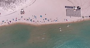 SARDINIA, ITALY – JULY 2016 : Aerial shot over Chia Beach island on a beautiful day with sea and people in view