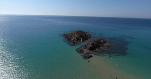 SARDINIA, ITALY – JULY 2016 : Aerial shot over Chia Beach island on a beautiful day with sea and horizon in view