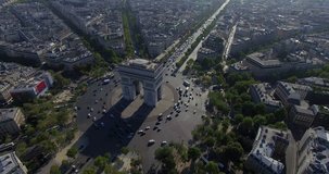PARIS, FRANCE – SEPTEMBER 2016 : Aerial view over Triumphal Arc traffic on a beautiful day with view of central Paris cityscape