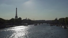PARIS, FRANCE – SEPTEMBER 2016 : Video shot over river Seine on a sunny day with Eiffel Tower in view