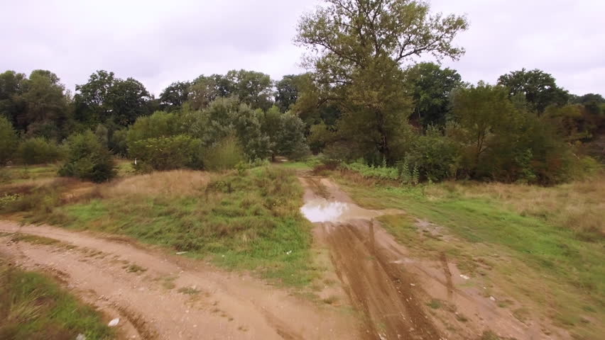 Aerial view of motocross dirt track drone following motocross riders off-road 4k