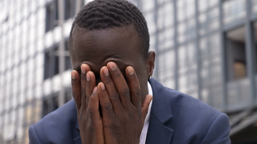 Bankruptcy, dismissal- sad and desperate black businessman outdoor | Shutterstock HD Video #1010005592