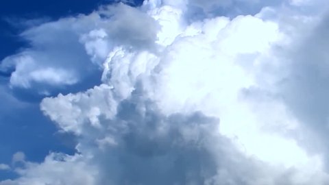 Clouds are Moving in the Blue Sky with Bright Sun Shining. TimeLapse. Beautiful White fluffy cloudscape over blue sky soar in Time lapse. background. 1920x1080, FULL HD.
