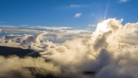 Aerial video with drone over the clouds - the Andes mountain range covered with clouds in the afternoon