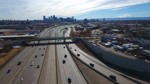 Aerial over traffic leading into downtown City of Denver Colorado