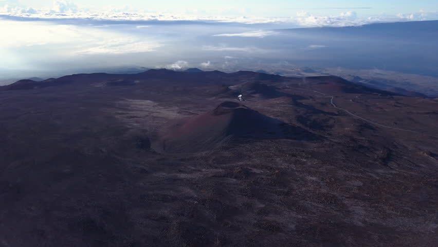 Flying around dormant volcano of summit of Mauna Kea mountain, Hawaii. USA Royalty-Free Stock Footage #1010033090