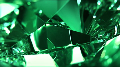 Close-up of slowly rotating green diamond. Seamless loop, nice looping background (4K,ultra high definition 2160p)
