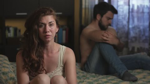 Sad Couple in bed- Male impotence- sexual problem
