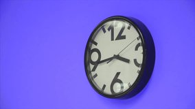 Clock. Clip. Clock on blue wall. Office clock on the wall