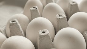Arranged chicken eggs in carton 4K slow pan footage