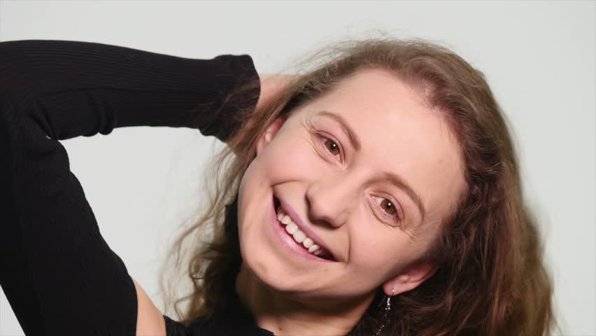 Closeup portrait of pretty woman smiling isolated on white background
