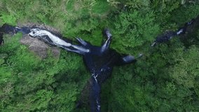Aerial view of Waterfall in green rainforest