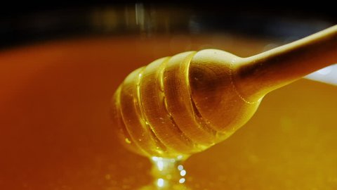 Dunk a wooden spoon in honey