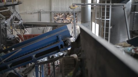 WROCLAW, POLAND APRILE 18, 2018: Plastic Trash waste moving on a Conveyor at the Garbage sorting Station