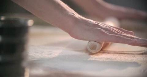 Rolling out a dough in slow motion