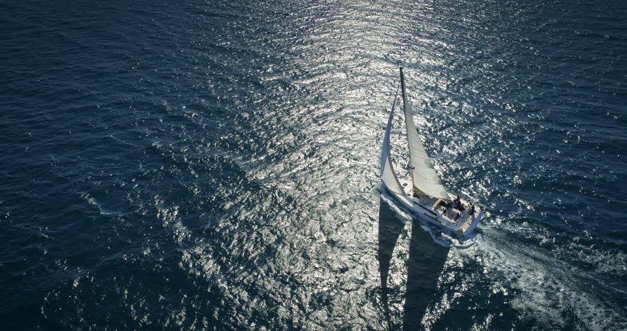 Yacht sailing on opened sea. Yachting with sails up at windy day. Royalty-Free Stock Footage #1010118128