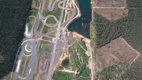 4K HD Aerial motorsports championship race track near forest and lake