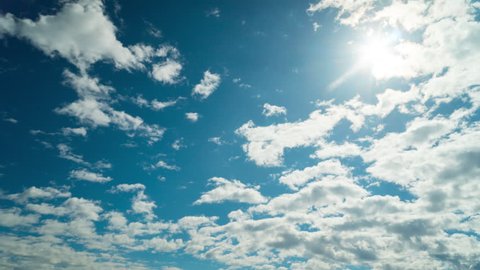 Clouds, sun and blue sky, time-lapse