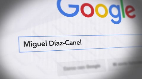 USA-Popular searches in 2018 Google Search Engine - Search For Miguel DIaz-Canel -  Monitor with reflection hands typing a search on google