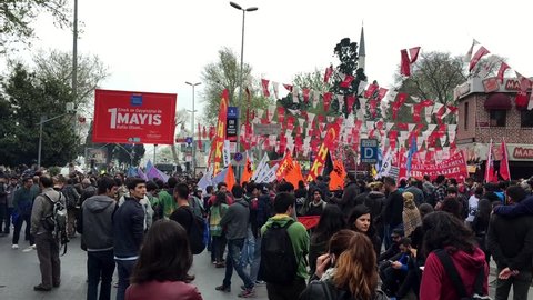 ISTANBUL - MAY 1, 2015: People during march at Besiktas Pier for labor day anti-government protest. They demand on solution of many social issues, such as corruption and unemployment.