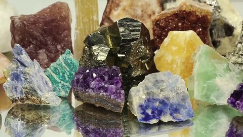Semiprecious stones and minerals lies on the mirror, the riches of the Earth
