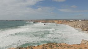 Beautiful views of the Atlantic Ocean and the rocks in the bay off the coast of Portugal. A place near the city of Sagres.