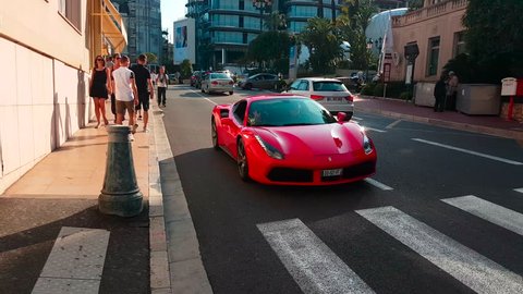 Monte-Carlo, Monaco - April 21, 2018: Man Driving A Red Ferrari 488 GTB In The Streets Of Monte-Carlo, Monaco in The French Riviera - 4K Video