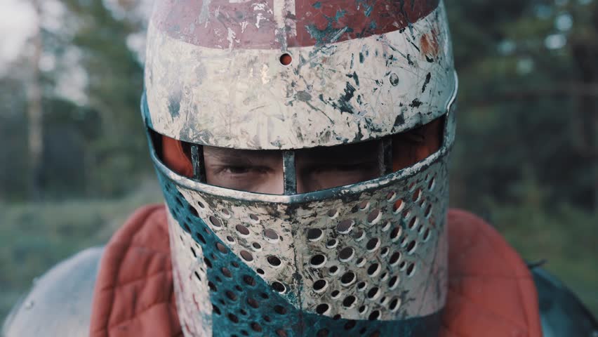 The face of the crusader who has become angry war in a helmet