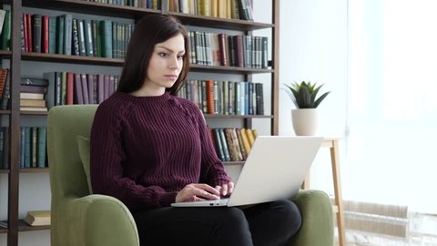 Excited Woman Celebrating Success, Working on Laptop
